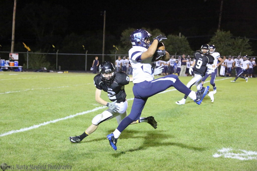 Miner Amilio Arguello picks off a Cam Baird pass and carries the ball to the Raton 12-yardline to setup a Miner score.