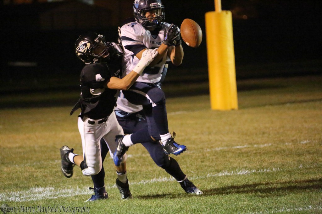 Raton's Luis Ruiz breaks up a pass play to Amilio Arguello late in the game