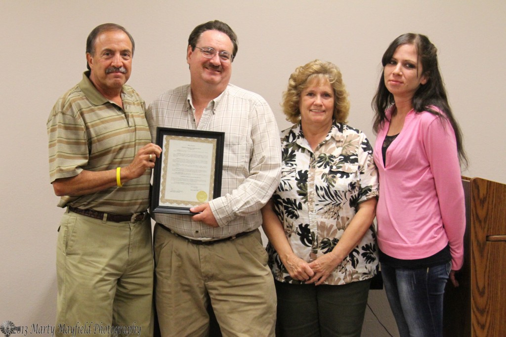 Lee Phillips, Janise Stuart and Angel Marquez accept the proclamation for Domestic Violence Awareness Month (October 2013) from Raton Mayor Bobby LeDoux Tuesday evening during the Raton City Commission meeting. 