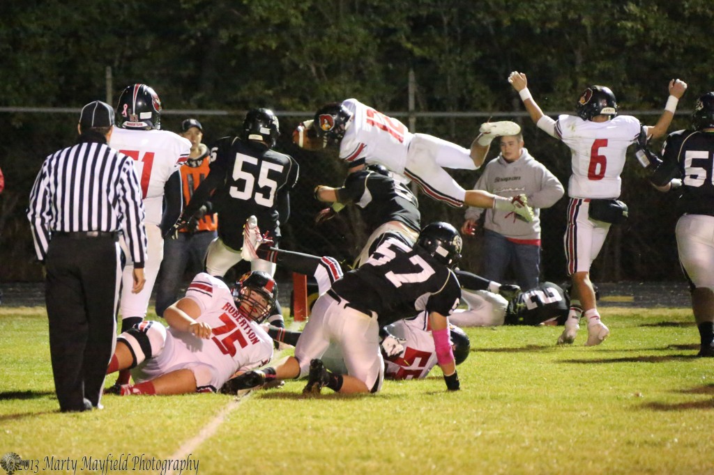 James Gonzales III flies high as he crosses the goal line for another Robertson TD. 