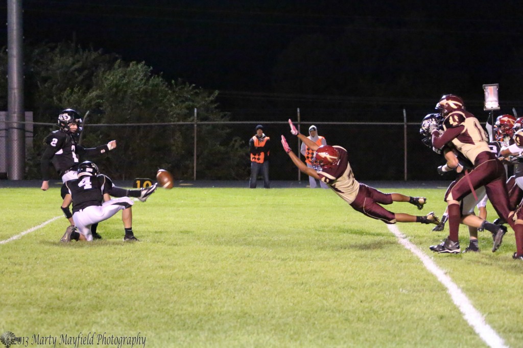 One of the many PATs that Toby Henson kicked on the night as the Braves go for the block.