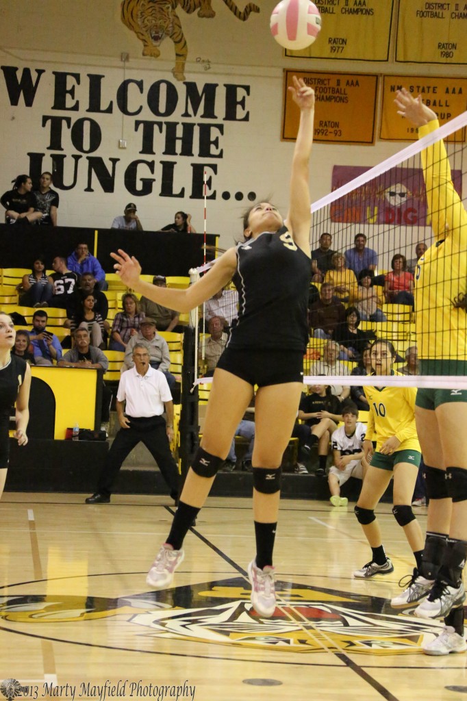 Kalista Dorrance tips the ball back to allow her teammates a chance to setup the ball for the a play over the net.