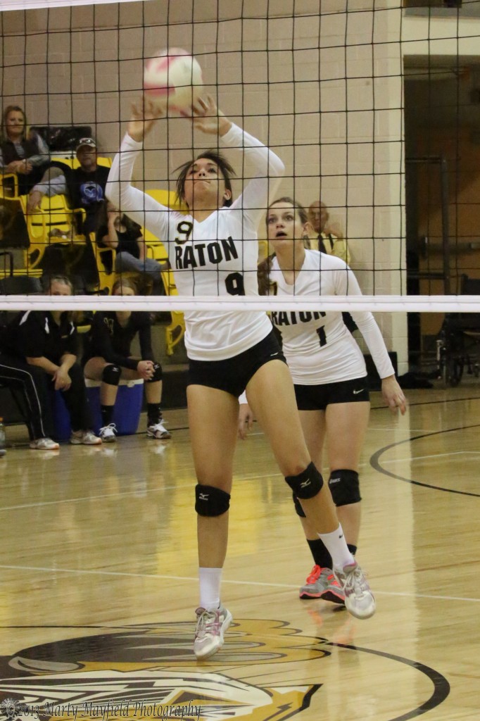 Kalista Dorrance makes the pass back over the net late in game 3 of the district tourney match against Taos.