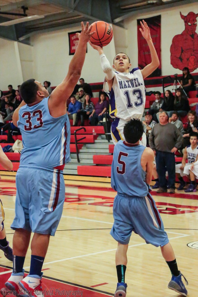 Aaron Salazar goes up for the jumper Tuesday night against Wagon Mound.