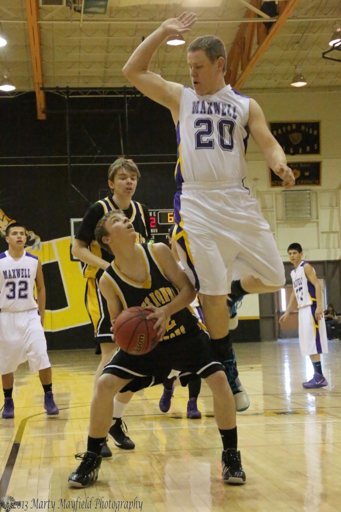 Thomas Casper (20) goes up to attempt the block as Preston Ogle looks to make a shot.