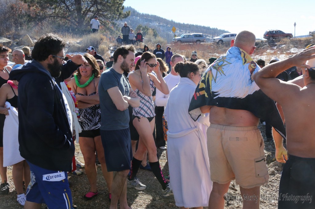 Participants prepare to make the jump New Year's day at Lake Maloya