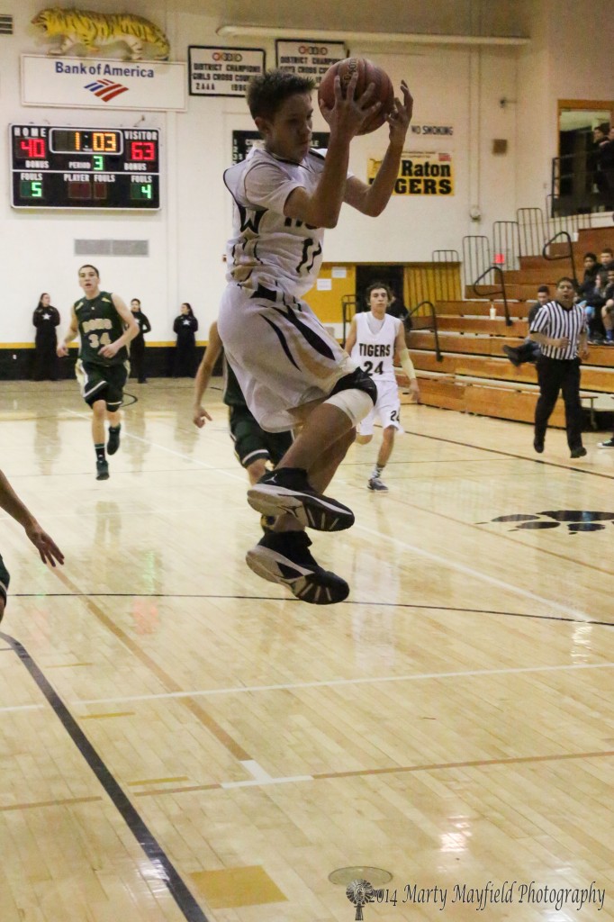 A high flying Kevin Fanelli reaches out for the high pass during the game in Tiger Gym Thursday evening