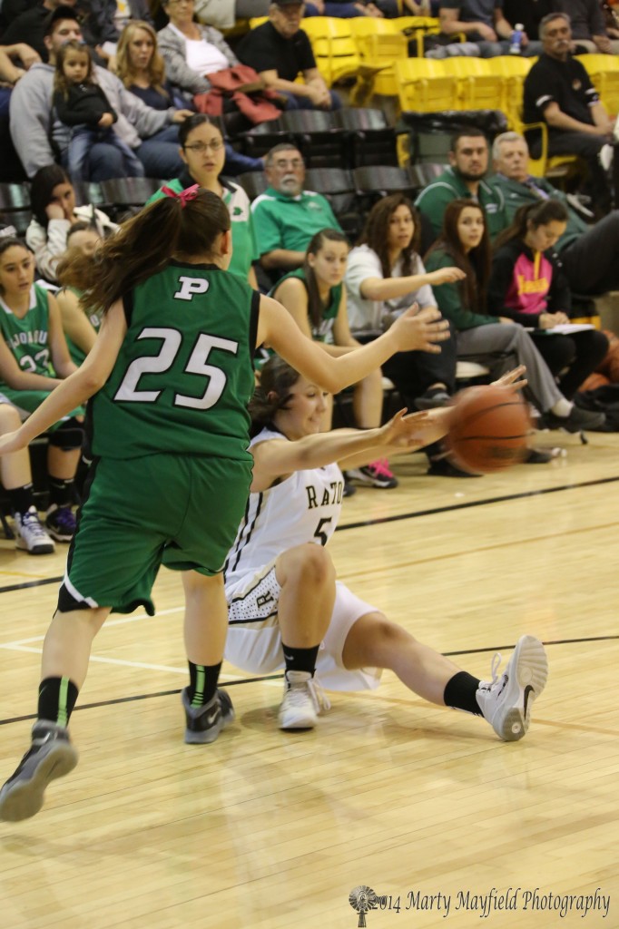 Sophia Madelini just gets the pass off as she heads for the floor as Justice Ainsworth moved in for the ball