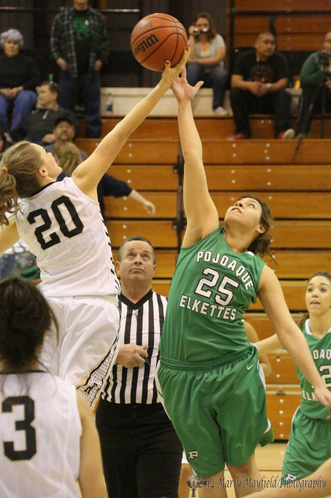 Mikala Vertovec takes the tip from Gabby Gonzales Saturday night in Tiger Gym