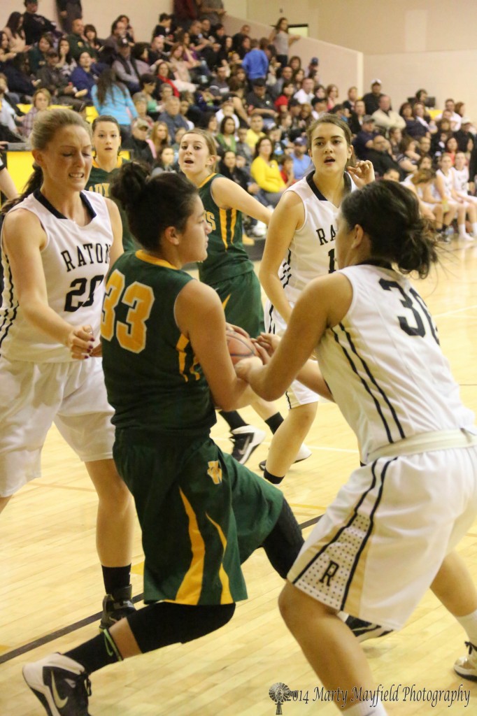 A scramble for the ball with Reyna Trujillo (33) and Michelle Guara (30) during the game Thursday evening in Tiger Gym