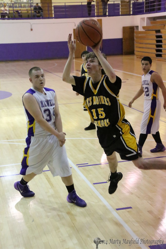 Tristen McNabb Glides in from the side of the basket for two during the District 1B tourney in Maxwell.