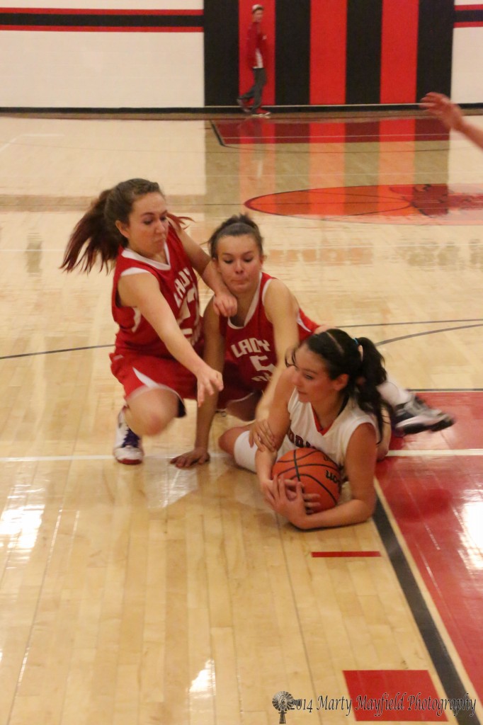 Its mine says Angelica Montoya as Holli Ariza (5) and Amy Gonzales (23) go for the ball 