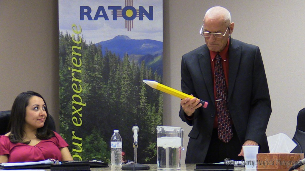 City Manager Butch McGowen admires his #200 pencil, it will accompany his Big Chief Tablet on his desk.