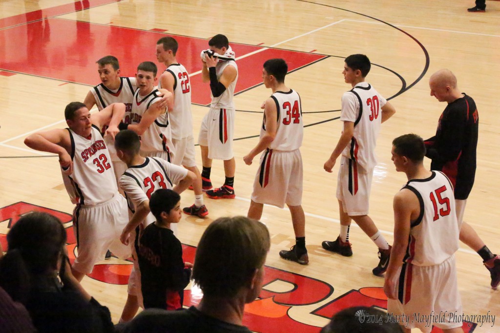 Cheers around as the boys celebrate their win over Ft Sumner Saturday night in the first round of state tourney play.