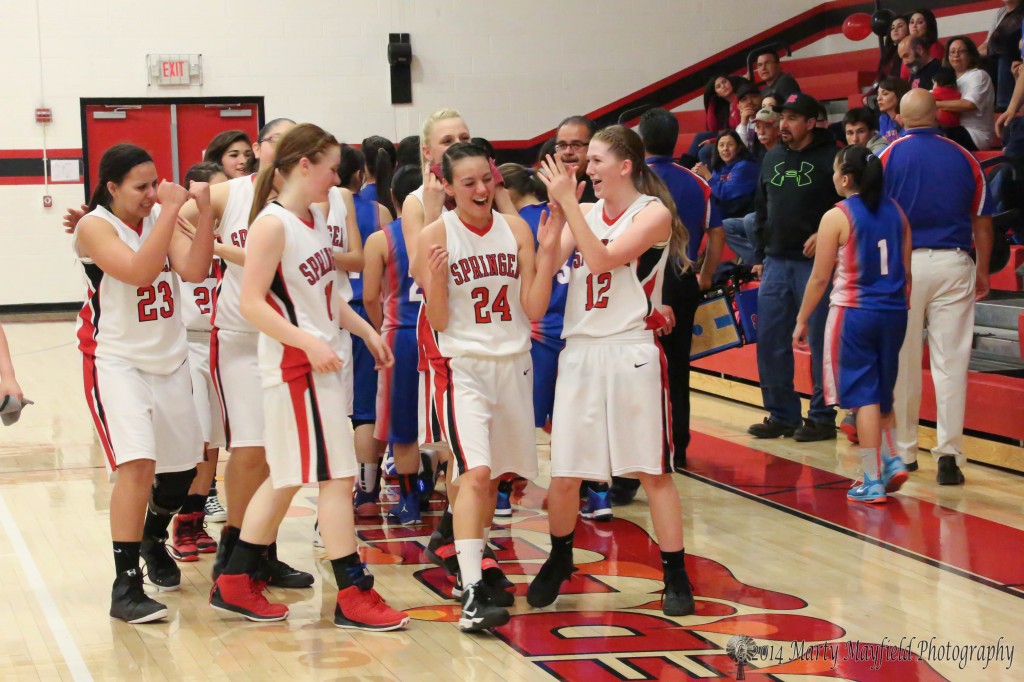 A jubilant group of girls as the #7 seeded Springer Lady Red Devils defeat the McCurdy Bobcats after trailing most of the game before tying and pulling ahead late in the game.