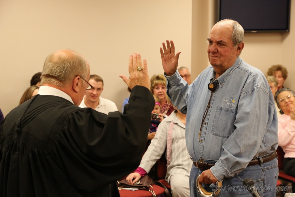 Municipal Judge Roy Manfredi is sworn in by District Judge John Paternoster