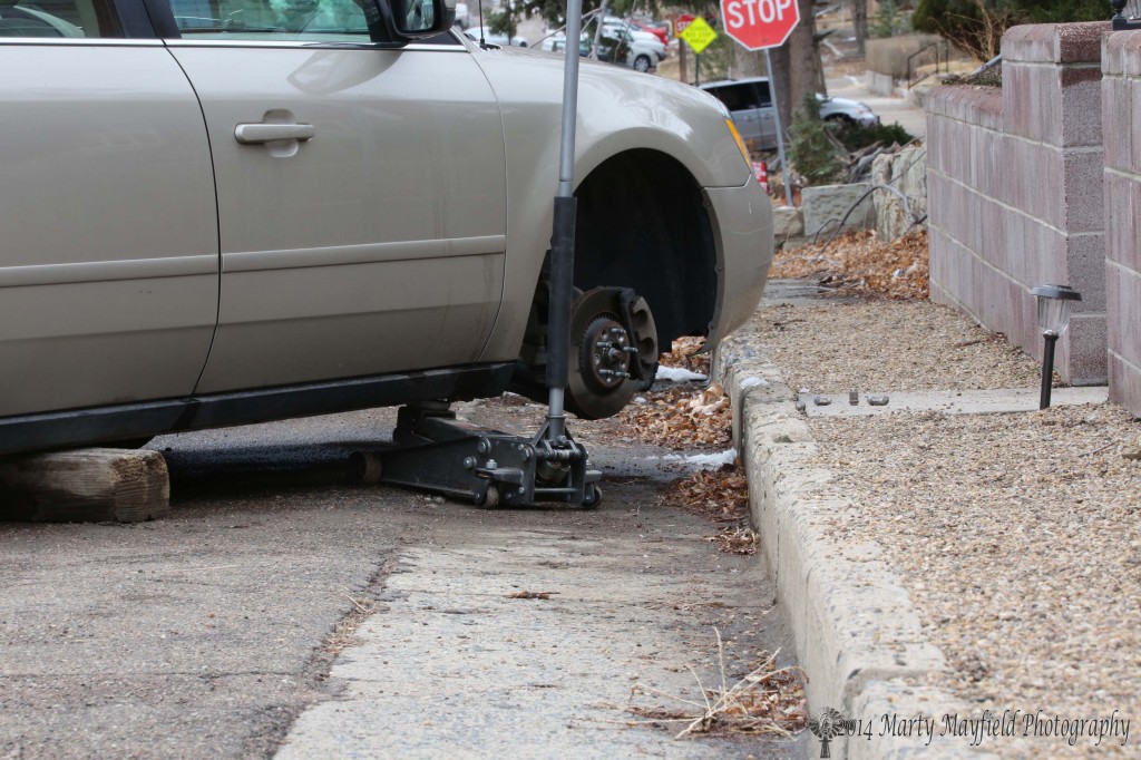Cars up on jacks or blocks was a common site Saturday morning as repairs to slashed tires were made.