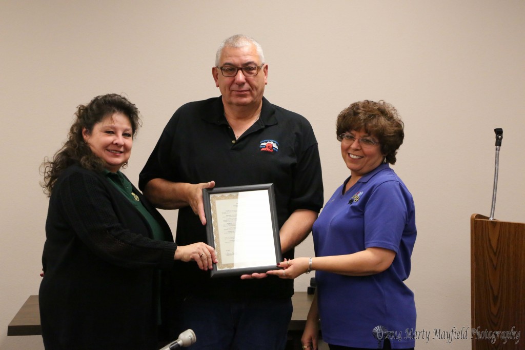 Carol Baca and Valerie Mojica, dispatchers at Raton PD accept the proclamation for Telecommunicators week from commissioner Jimmy Fanelli. The proclamation promotes the work that dispatchers do by dispatching emergency personnel to emergencies. Dispatchers provide a calming effect to callers during times of emergency and stress.