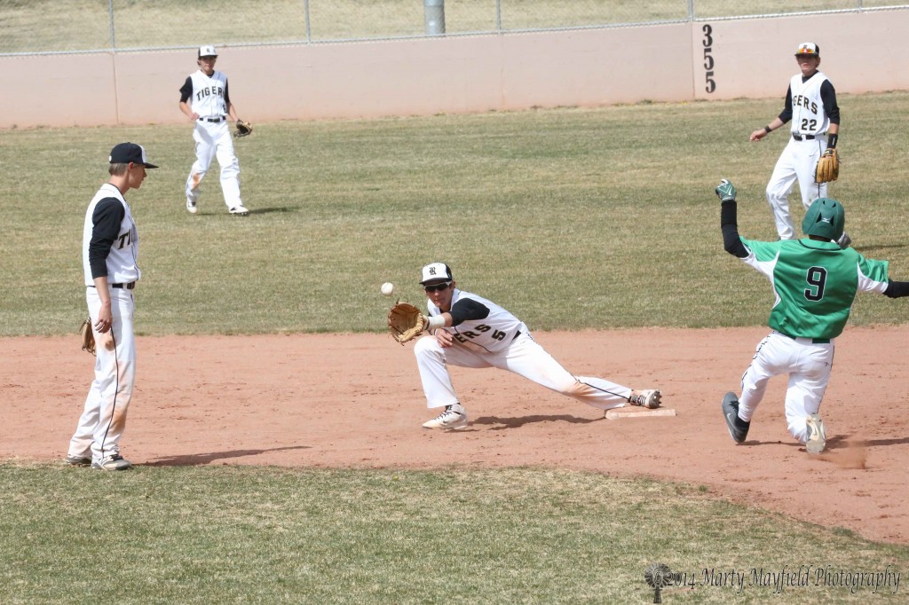 Its a wide throw that allows Dominic Roybal to make the slide safely into second as Dante Mileta goes for the tag.