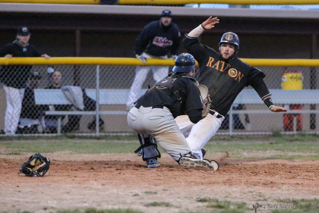 Third baseman Chris Williams is tagged out after trying to steel home on a wild throw home.