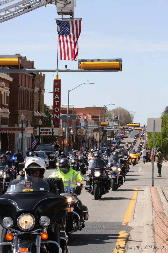 Raton Fire and Emergency Services hung a flag above Second Street Saturday to wave the riders on.