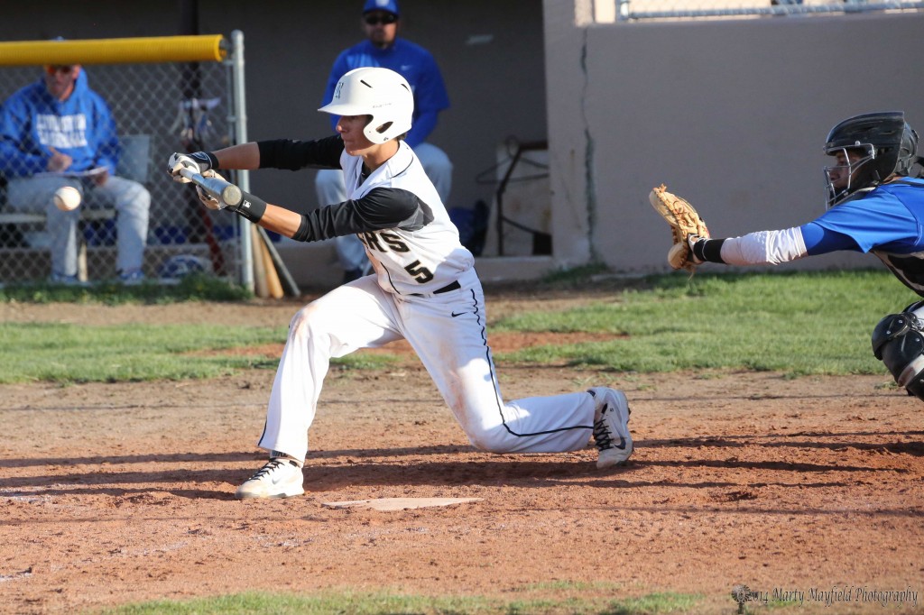 Dante Mileta goes for the bunt during the first round game against Lovington Friday afternoon