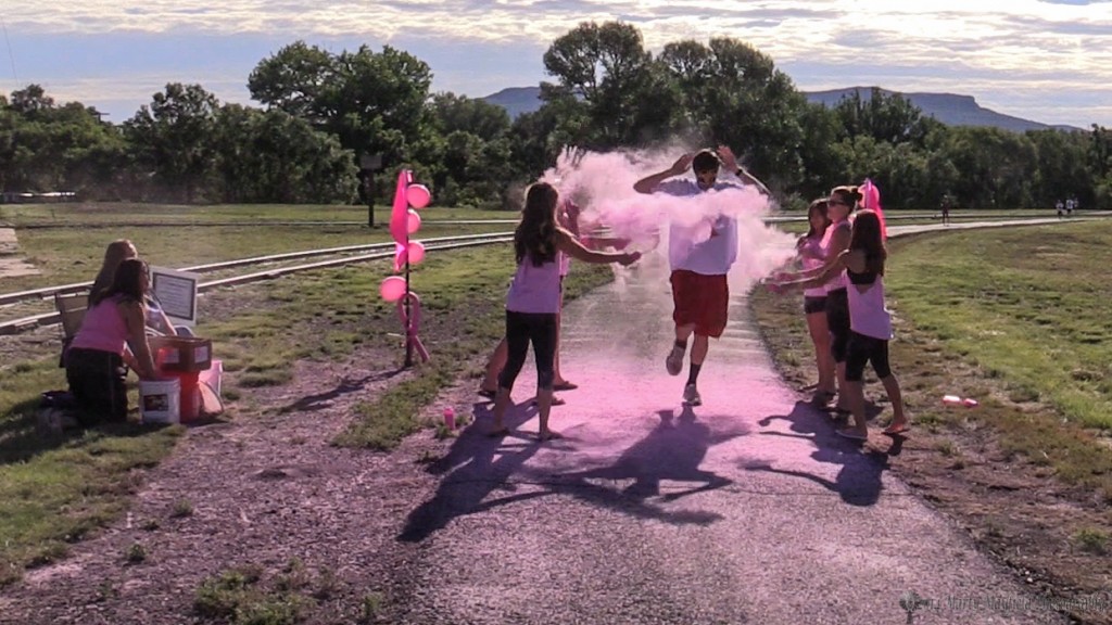 Runners and walkers were dowsed with a colored powder as they went by one of four color stations Saturday morning during the "Color for the Cure" event held at Roundhouse Park.