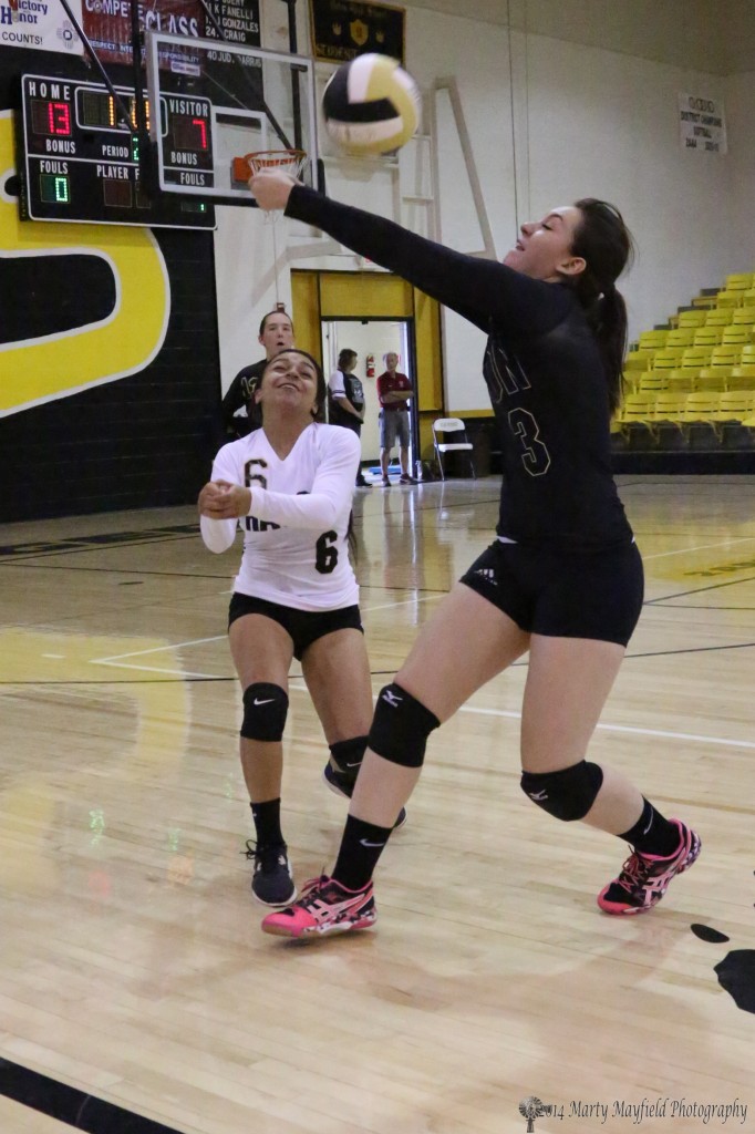 Lauren Romero chases the ball out of bounds to keep it in play Saturday during the JV match with Espanola Valley