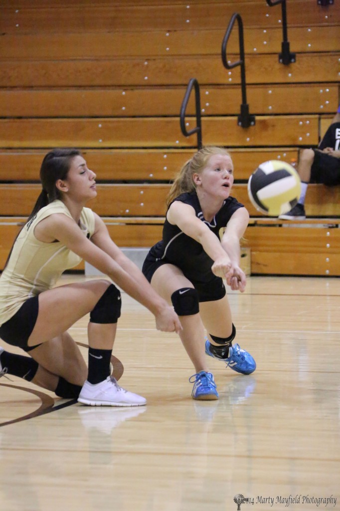 Alicia Pais and Daisy Earle go low to make the pass Saturday afternoon in Tiger Gym