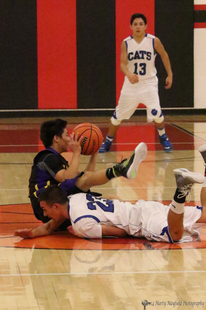 Aaron Salazar comes out on top with the ball as he and Zack Gallegos go for the loose ball Wednesday evening in Springer. 
