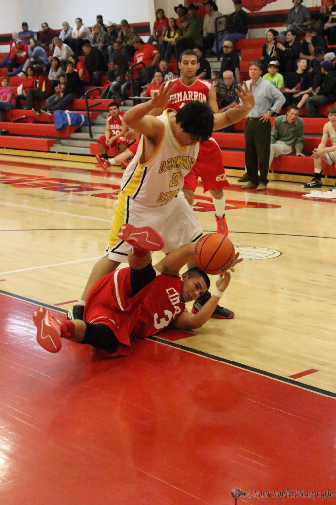 Frank Cortez finds himself on the floor as he slips during the game with Hector Guerrero trying to avoid a tumble too.