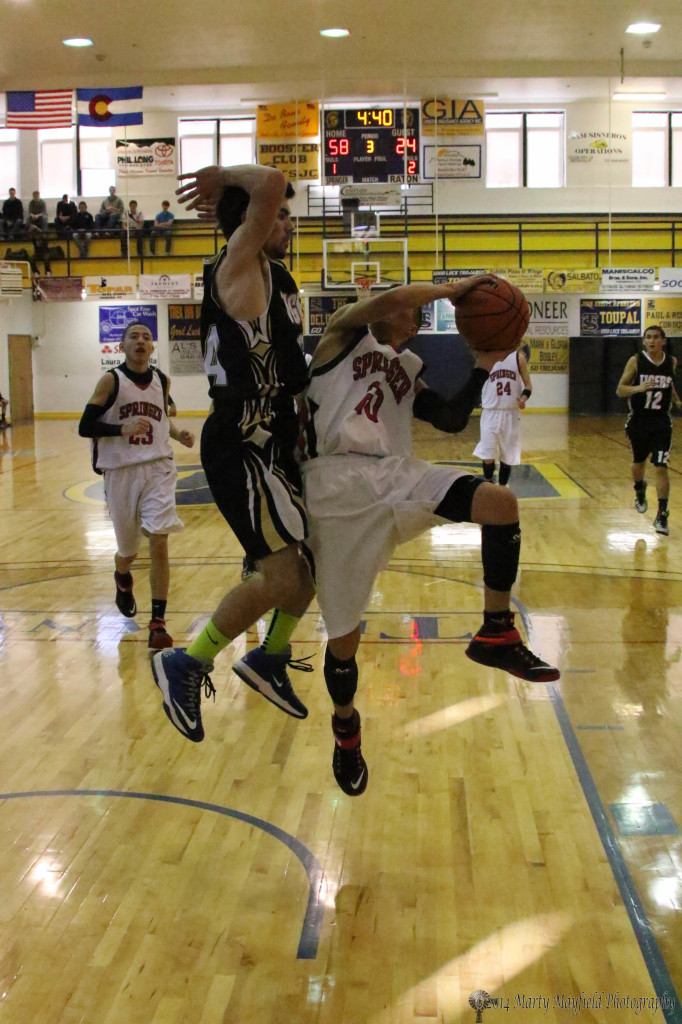 Anthony Romero goes up for the shot as Connell Ware goes for the block Friday afternoon in the TSJC Tourney