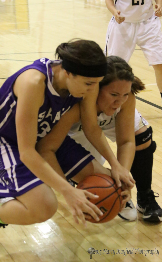 Amber Higgons and Sydni Silva struggle for the ball Friday night in Tiger Gym