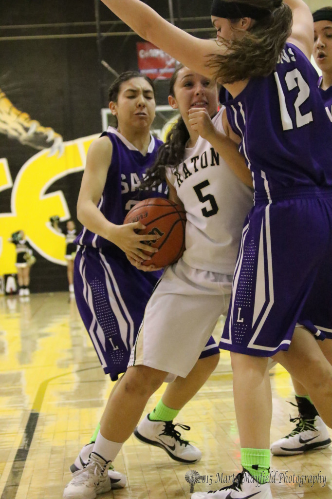 Sophia Maddelini has a grip on the ball as Jadyn Romero tries to take it away but Sophia wouldn't have allow it while the referees called it a tie ball.