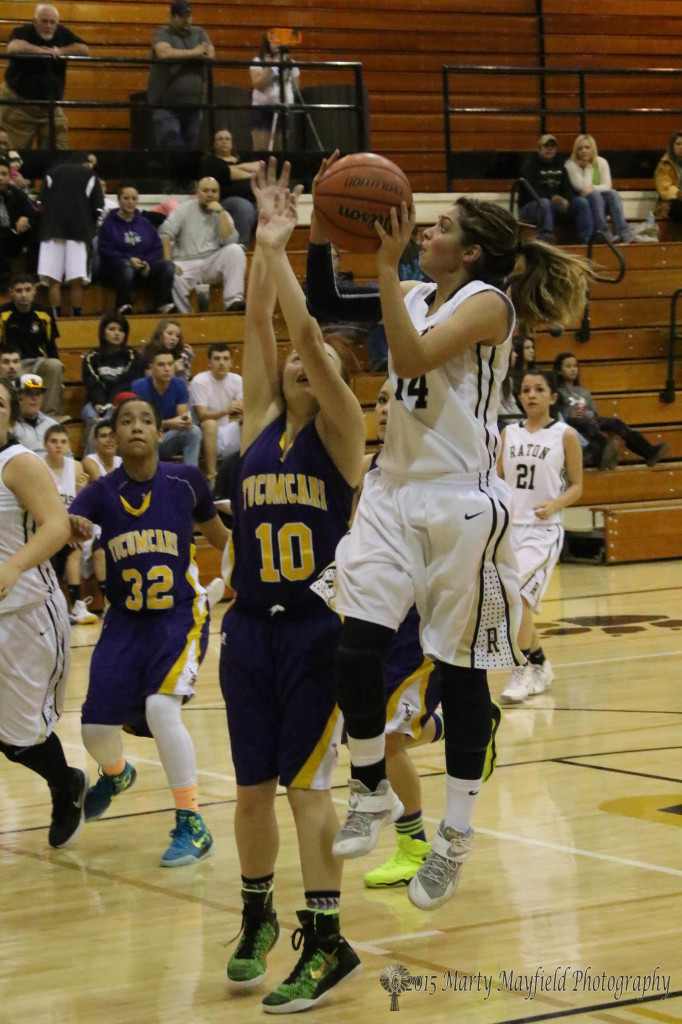 Brianna Pais goes for the basket against Alyssa Martinez(10) on her way to a high point honor with nine points Saturday evening 