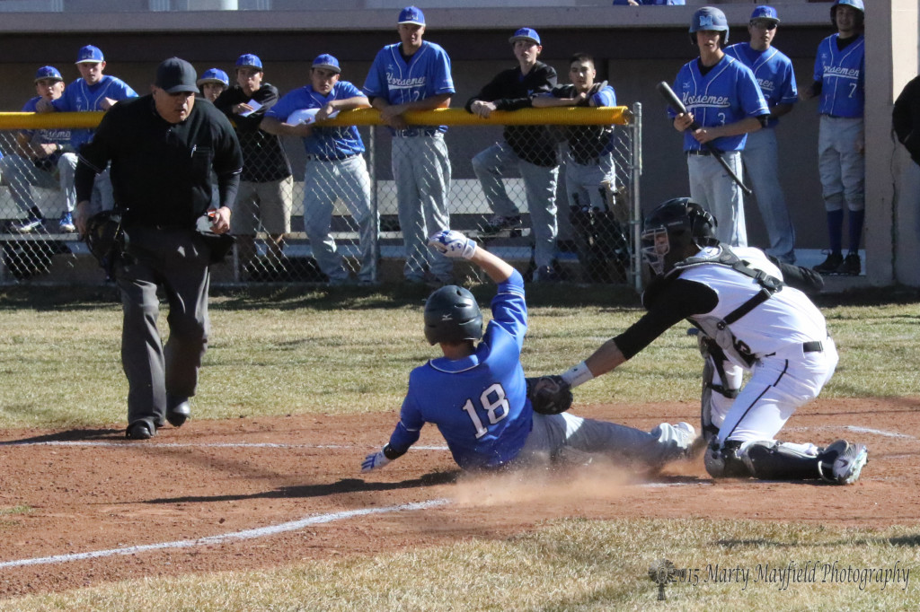Catcher Dante Mileta makes the tag just in time before the St Mikes player touches home plate.