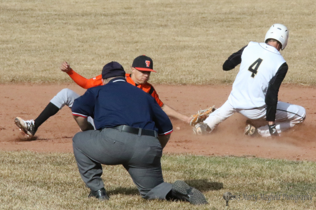 Ethan Washburn is tagged out as he slides for second Saturday afternoon at Gabrielle Field.