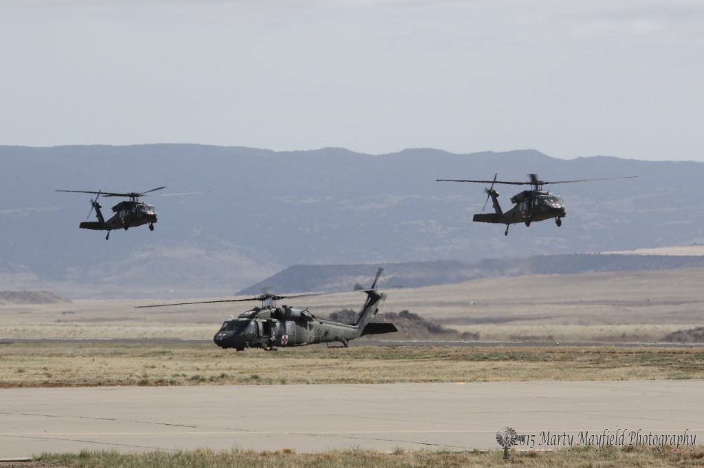 Blackhawk helicopters land at the Crews Field Airport Friday morning. The military is just one of the many users of the Raton airport. Many stop for fuel or simply a break during a long flight.