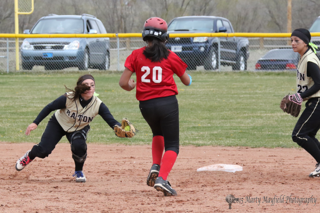 Caydence Sisneros goes for the tag as Chaslyn Tafoya heads for second during game two of the double header Saturday.