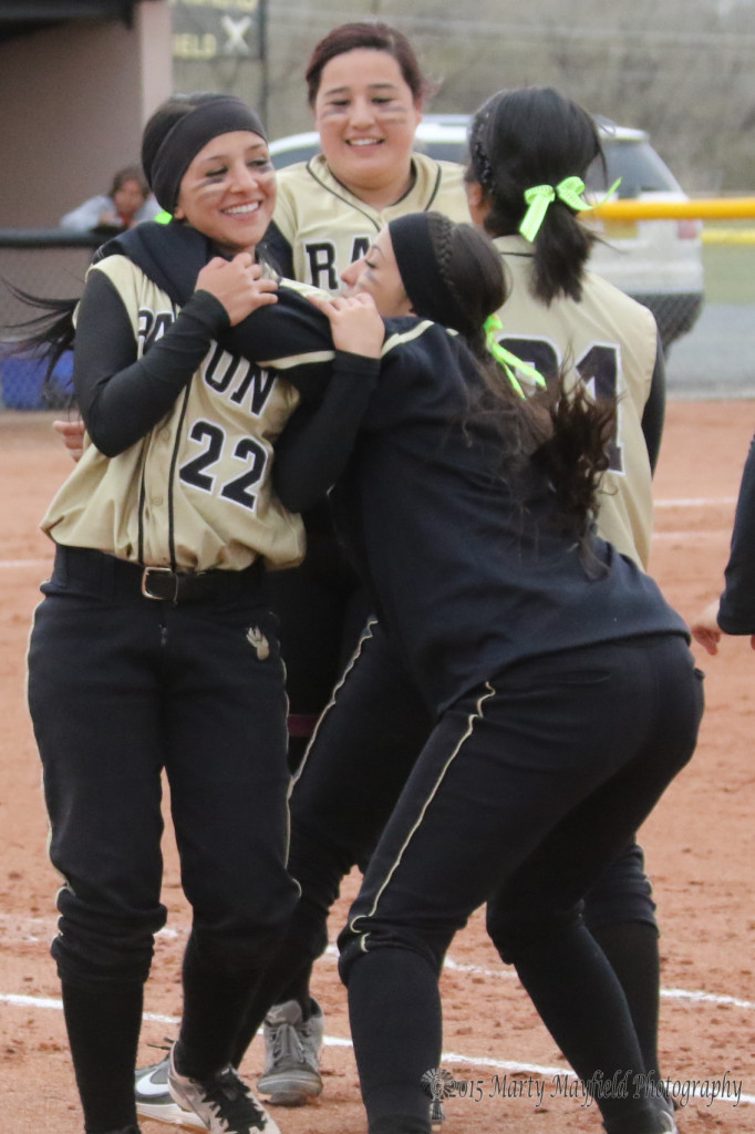 The girls celebrate as they put another mark in the win column Saturday after shutting out the NACA Lady Eagles 15-0 and 22-0 