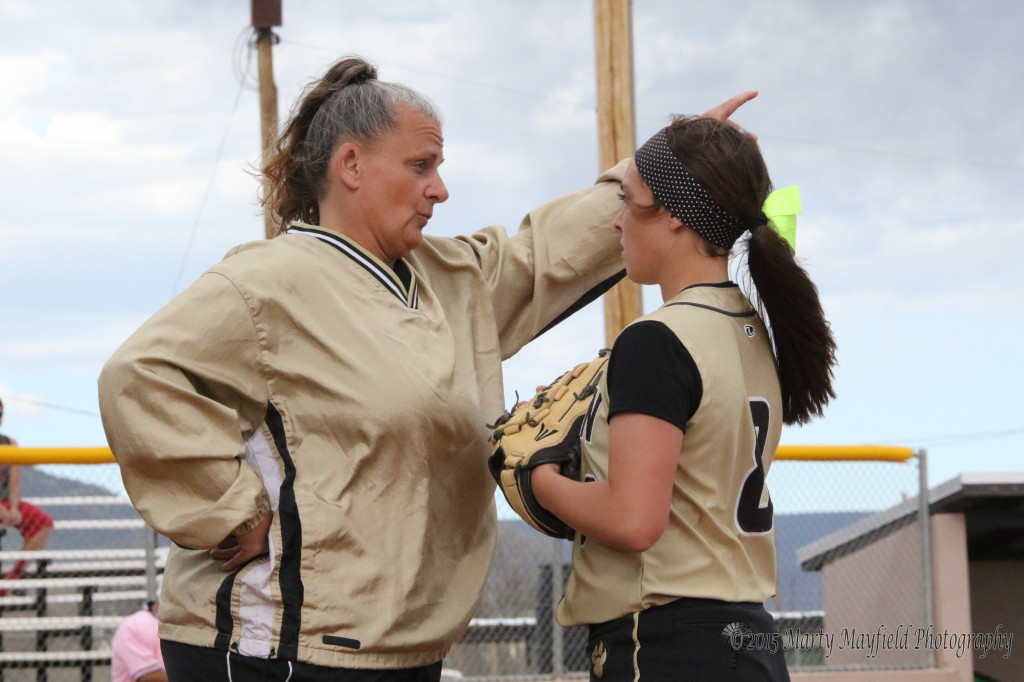 Coach Tina Dorrance instructs Caydence Sisneros on what she wants her to do. 