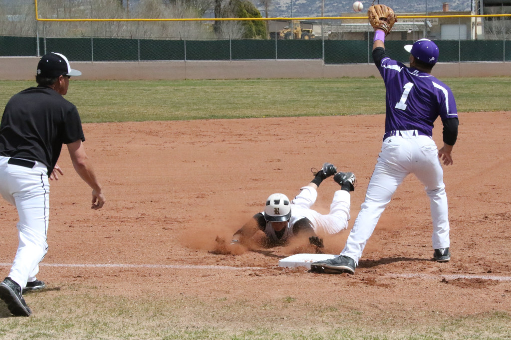 Ethan Washburn slides safe into third base during game one of a double header Saturday with Santa Rosa