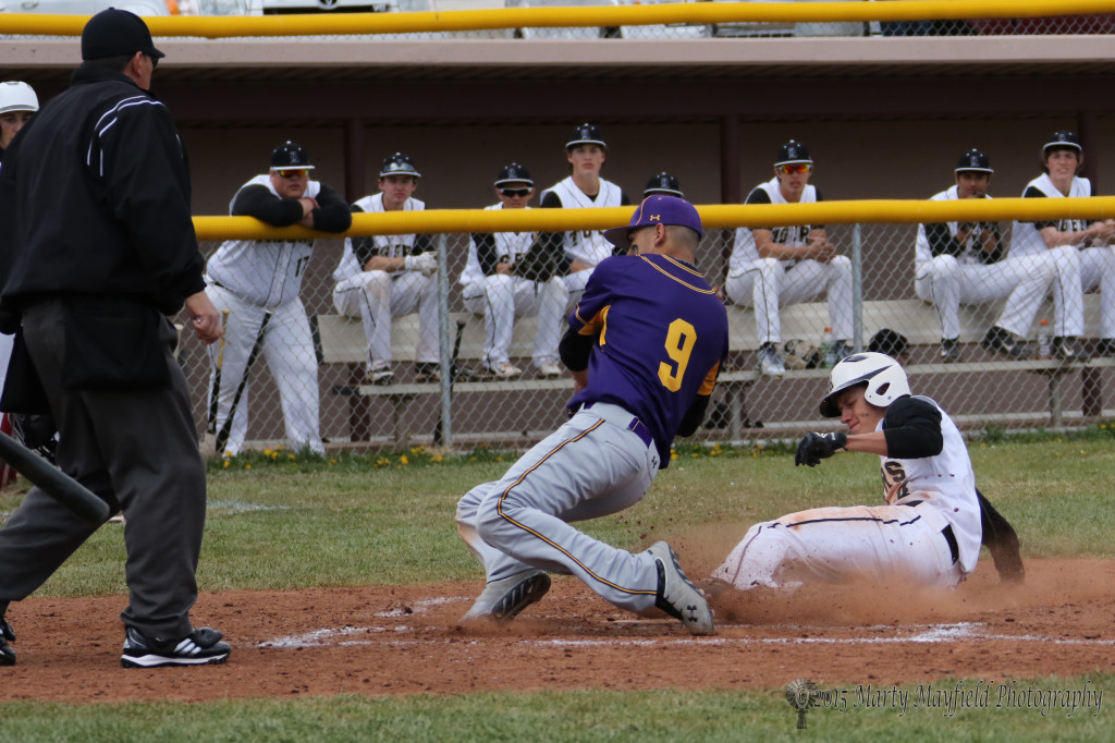 Easily safe at home is Ethan Washburn as pitcher Javier Villanueva get the throw from the catcher Saturday afternoon