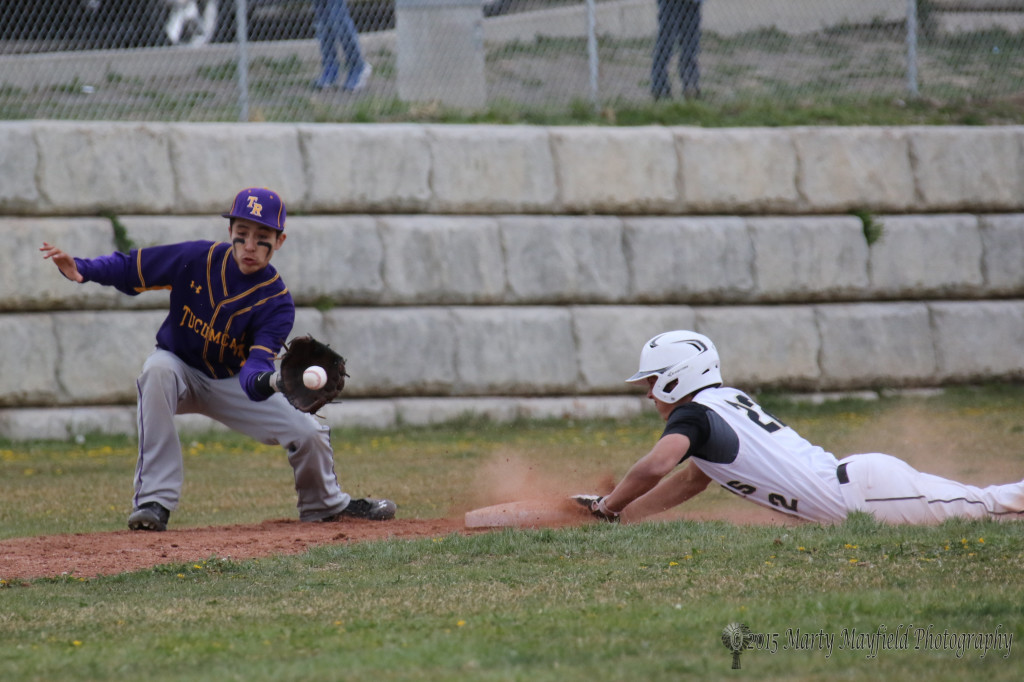 Dillon Lemons slides up on third as the ball arrives at the mitt of the third baseman Nathaniel Lopez during the game with Tucumcari Saturday afternoon.