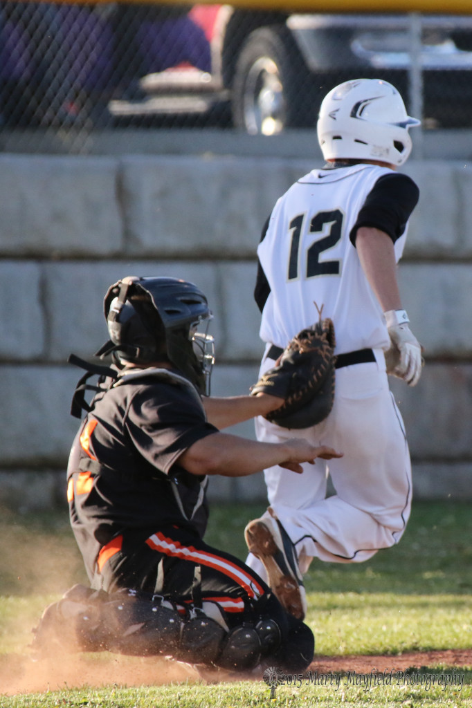 Clayton catcher Seth Martinez chases down Danny Record as he gets caught in the pickle on a bunt attempt and steal that worked earlier in the game.