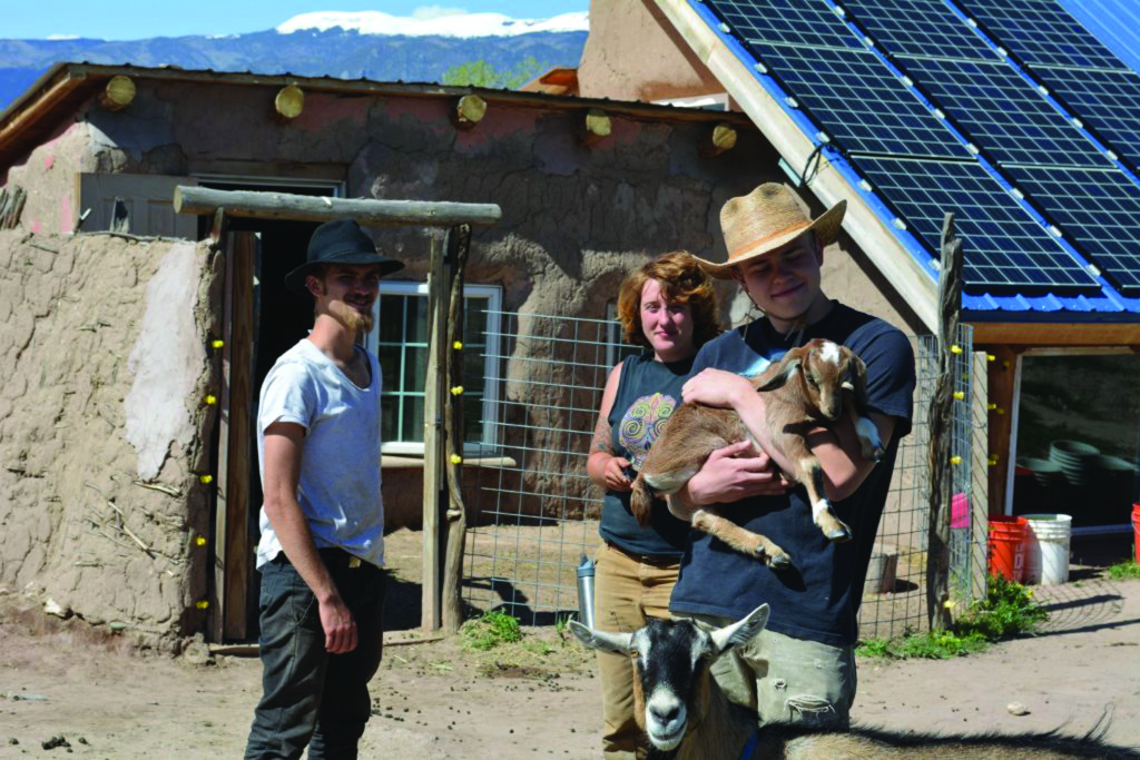 The Shii Koeii Community, located along the Huerfano River near Gardner, utilizes interns from around the world to grow organic food, take care of dairy goats and chickens, and to learn about the practices of living in an intentional community. Picture above are three of this year’s interns (L to R) Ben Mark from London, England; Kristen LeBlanc from Baton Rouge, Louisiana; and Beaman Martin from San Antonio, Texas. They, along with several other interns can be found at area farmers markets as they bring their harvests to the people of Huerfano County. Similar sustainable agriculture programs can be found throughout Huerfano County as the Farm to Table movement prospers. Photo by Bob Kennemer. 