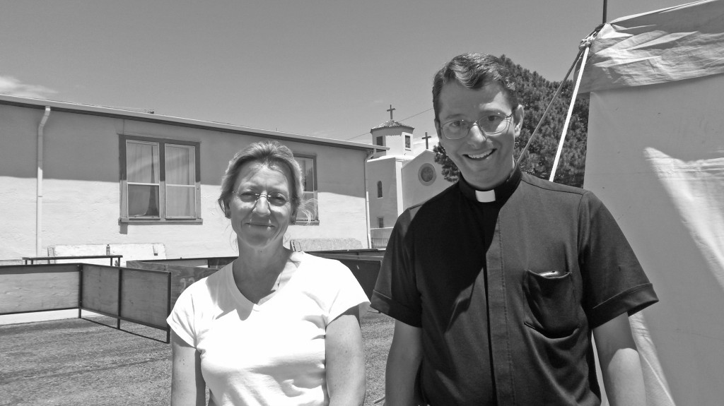 Kathy Honeyfield and Rev John Trambley at this year's Parish Fiesta.  Photo by Colette M. Armijo.