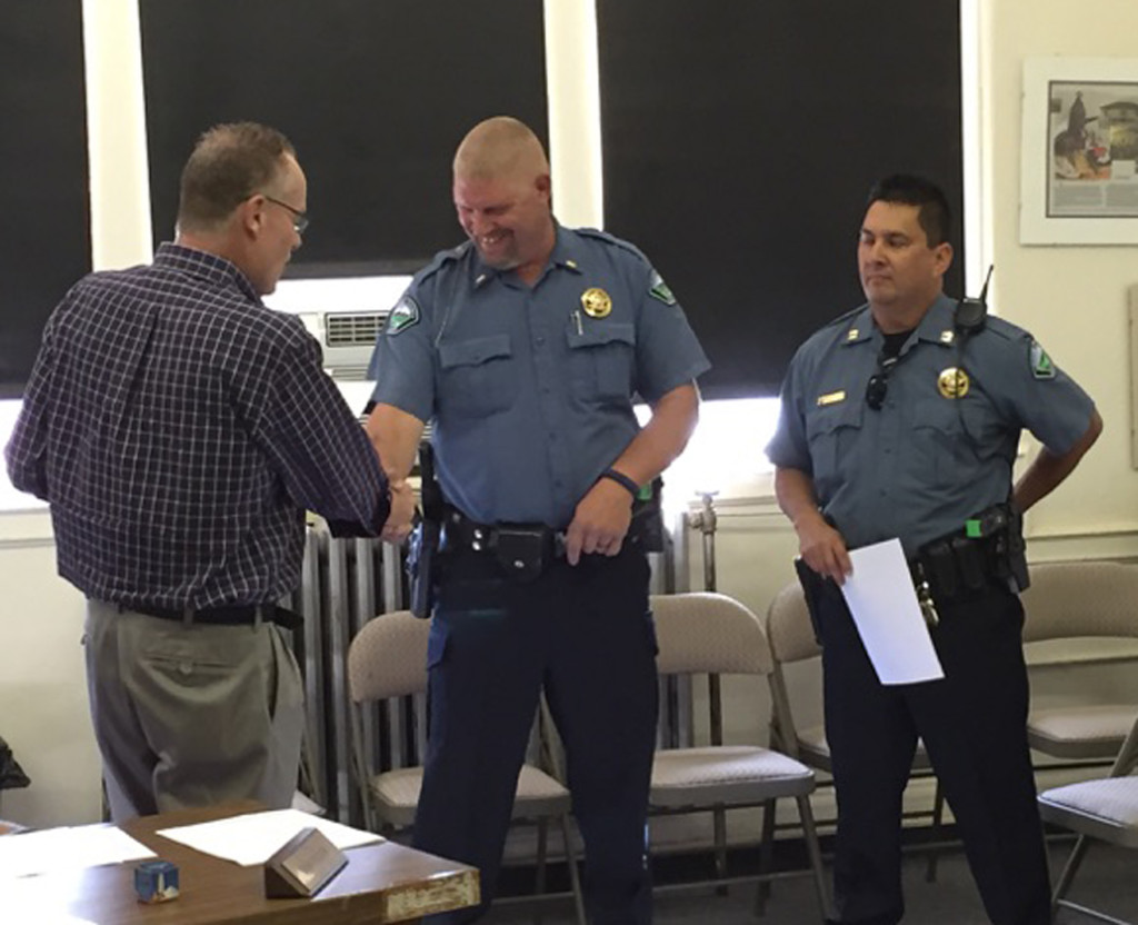 Pictured above, l to r;  RE-1 Schools Superintendent Mike Moore congratulates Lieutenant Milan Rapo and Captain Kevin Vallejos. Photo by Rhonda Hribar.