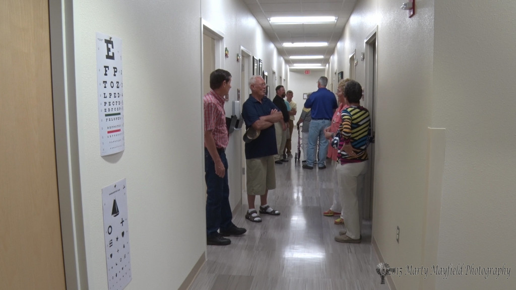 Visitors view the exam rooms and office space that populate the new rural health care clinic 
