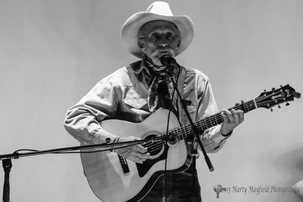Its their own brand as cowboy song writer musician Doug Figgs entertains the crowd at the El Raton Theater Sunday afternoon.